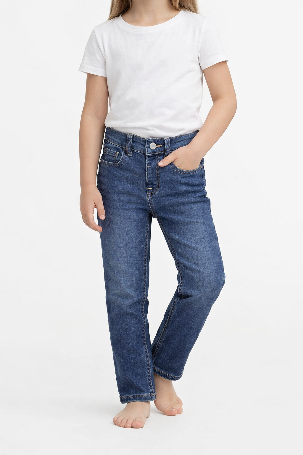 sps-kids-denim-jeans-front-worn-model1 Person wearing blue jeans and a white t-shirt on a white background